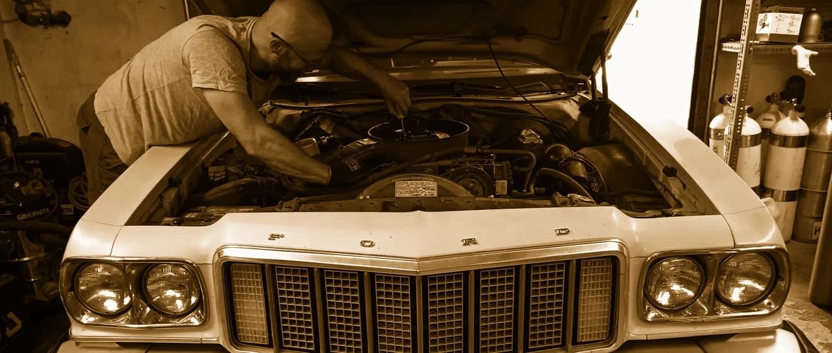 Vehicle tinkering in￼ the garage